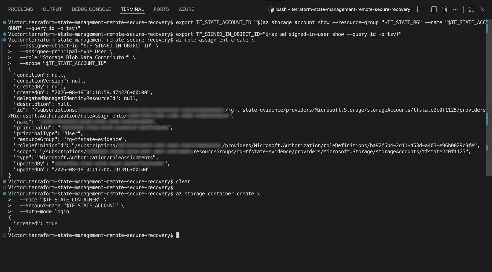 Terminal output showing the Storage Blob Data Contributor role assignment and successful tfstate container creation, with identity and subscription identifiers concealed